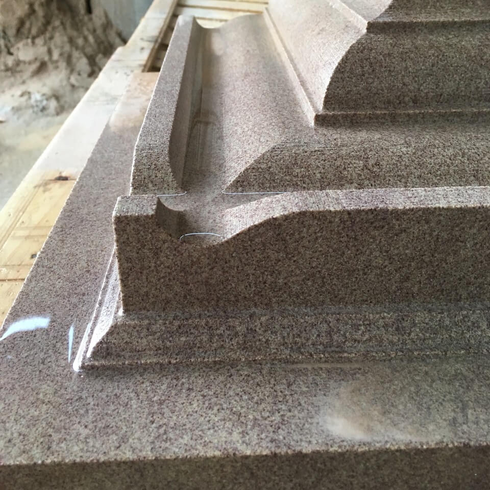 CNC stone carved feature with fine details and smooth curves by Buxton Architectural Stone