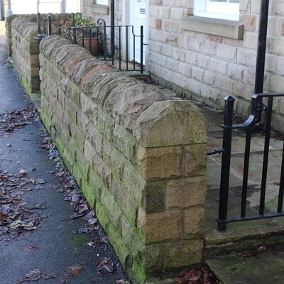 Half round coping stones manufactured by Buxton Architectural Stone